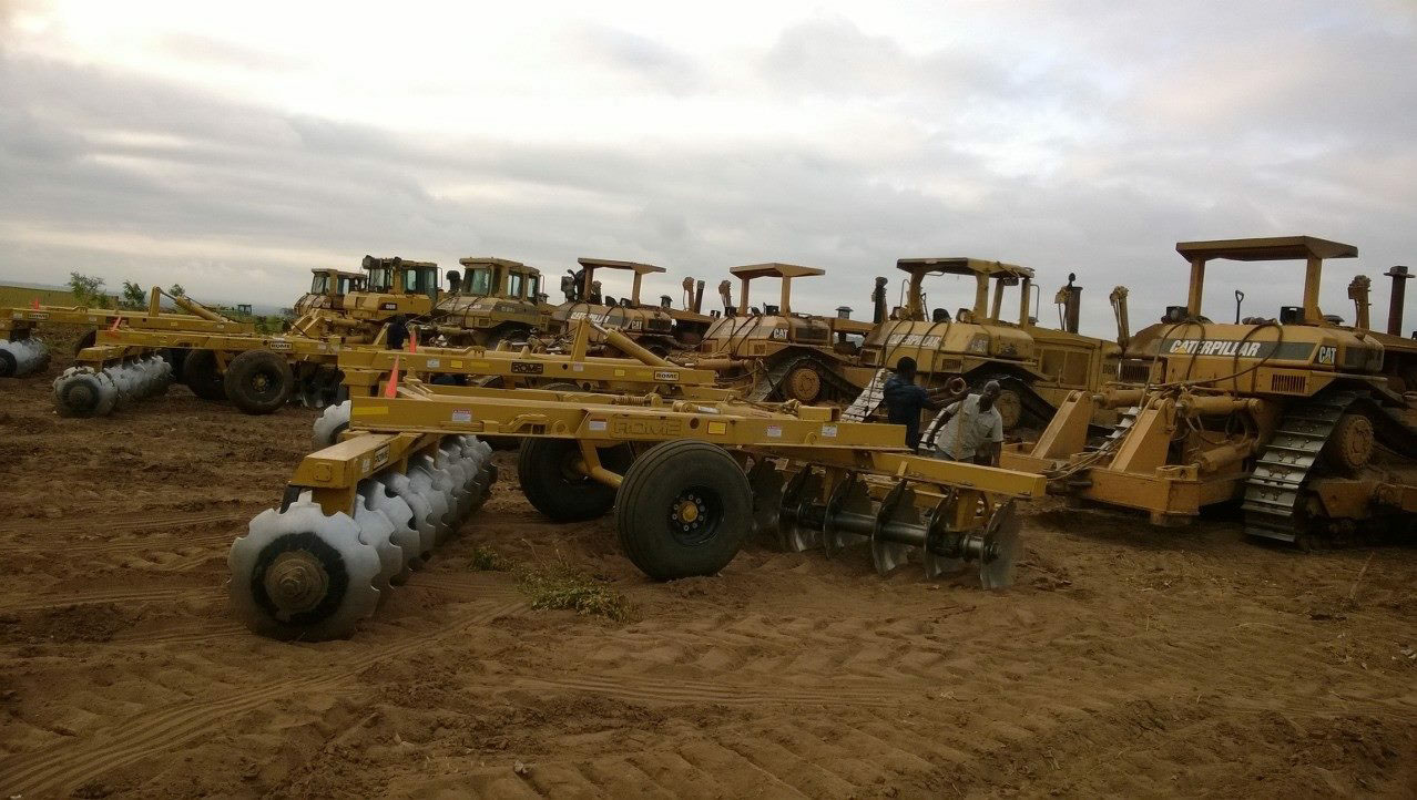 Bulldozers hooked to Rome plough